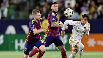 May 11, 2024; Carson, California, USA; Real Salt Lake defender Andrew Brody (2) and LA Galaxy midfielder Riqui Puig (10) chase a loose ball during the first half at Dignity Health Sports Park. Mandatory Credit: William Navarro-USA TODAY Sports